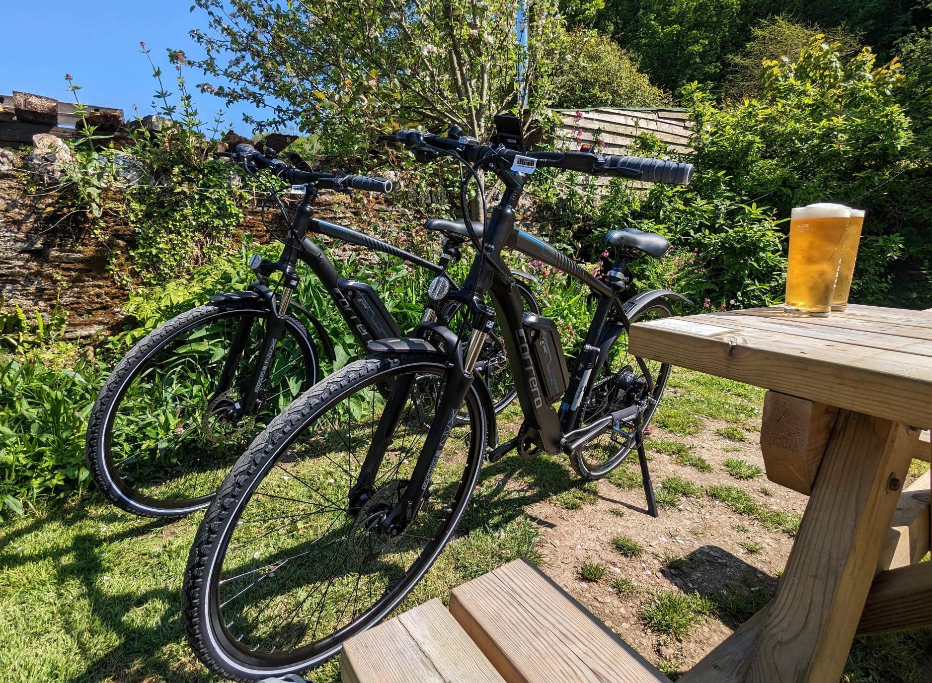 Easy riders E Bike Hire Ilfracombe North Devon Single Cyclist Image Lee Bay Bikes in the woods Bikes in Lee Bikes and sea view Bike on country lane Beers and bikes